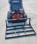 Small But Mighty Mini Skid Steer Loader With Leveler, 1800lbs Capacity, shown on a concrete surface, front angle