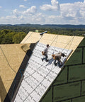 Top Shelf Synthetic Roof Underlayment Roll Covers 10 Squares Heavy Duty Waterproof Barrier laid on a steep roof by contractors.