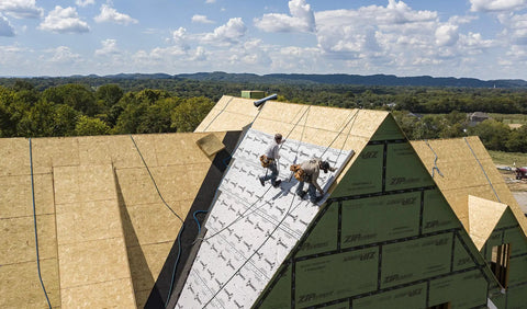 Top Shelf Synthetic Roof Underlayment Roll Covers 10 Squares Heavy Duty Waterproof Barrier laid on a steep roof by contractors.