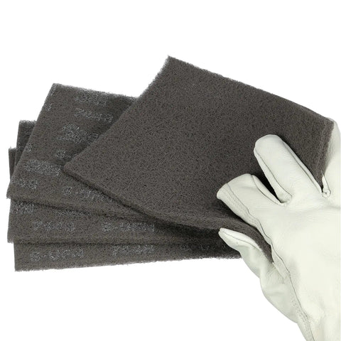 Ultra Fine Grade Hand Pad For Surface Prep And Finishing, Nonwoven Silicon Carbide Scrub Pad, 6 X 9 Inches, Gray, Case Of 60, held by glove