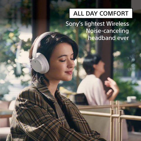 Woman wearing Lightweight Noise Cancelling Wireless Headphones With Alexa Built In Ultra Comfortable Over Ear Fit At 192g.