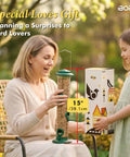 Woman holding Six Port Metal Bird Feeder With Heavy Duty All Metal Construction 15 Inch Hanging Seed Feeder For Mixed Seed Blends And Sunflower Hearts Green Finish Gift Box Included
