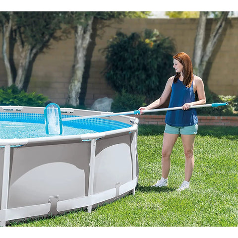 Woman using the Deluxe Above Ground Pool Maintenance Kit With Vacuum For 800 GPH Flow Rate 110 Inch Telescoping Pole Wall Brush And 24 Foot Hose Color May Vary So You Can Clean Like A Pro No Hassle on a summer day.