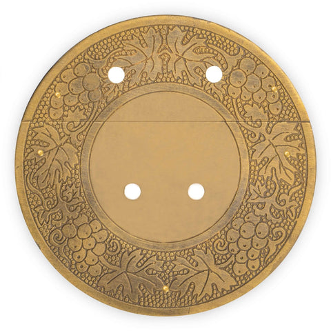 Circular brass decorative plate with intricate floral design, featuring holes for easy mounting.