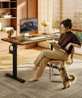 Rock Solid Sit Stand Desk 48 By 24 Inch One Piece Rustic Top Black Frame with woman reading in casual home office.