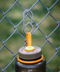 Go To G Series SlideLock Dual Chamber Carabiner Keychain Stainless Steel holding bottle on fence