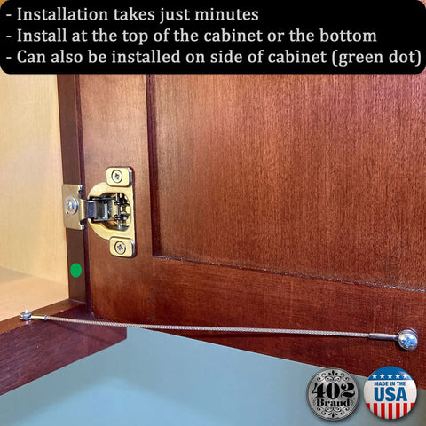 Wooden cabinet with Built Tough American Made Stainless Steel Cabinet Door Restraint Kit with Flexible 304 Stainless Wire Rope installed.