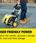 Person pulling Heavy Duty 1700 PSI Pressure Washer With 1.2 GPM, 3 Nozzles, Detergent Tank on never-flat wheels