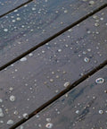One Gallon Ready To Roll Deck Stain Stripper Cuts Straight Through Weathered Oil And Water Coats on wooden deck surface with bubbles.