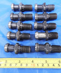 Pro Shop Ready Cat40 Coolant Thru Tool Holder Lot features rugged pull studs in a neat row on a blue surface.