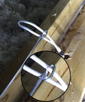 Pro Grade Heavy Duty Fish Tape Wire Puller With Double Loop Tip for cable pulling through wooden beams close-up view.