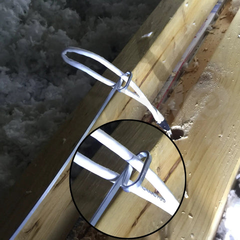 Pro Grade Heavy Duty Fish Tape Wire Puller With Double Loop Tip for cable pulling through wooden beams close-up view.