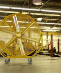 Heavy Duty 8 Foot Portable Industrial Fan With Smooth Rolling Caster Wheels being moved in a spacious garage.