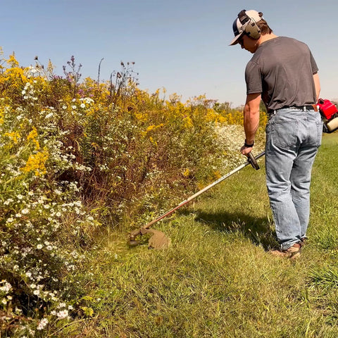 Man using trimmer with Pivotrim Commercial Grade Trimmer Line Replacement Strips.095 Inch Diameter 12 Inch Length 24 Strips Per Pack