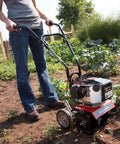 Gardener using Cultivator With 43Cc 2 Cycle Viper Engine 6 To 10 Inch Adjustable Width 8 Inch Maximum Depth on soil