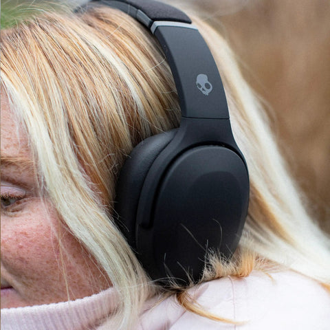 Person wearing Crusher Evo Wireless Bluetooth Headphones With Dope Multi Sensory Bass, Noise Isolating Over Ear Fit, True Black