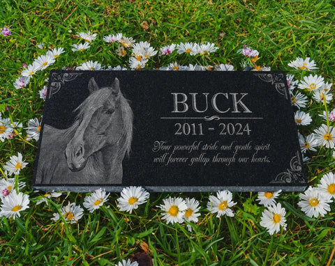 Black granite Custom Horse Memorial Stone For Garden And Grave Marker with horse image and engraving on grass.