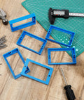 Twelve Piece Half Inch Single Gang Electrical Box Extender Kit With Twenty Four Screws For Outlets And Switches Blue Keeps Receptacles Flush And Prevents Recessed Sockets For A Seamless No Fuss Installation displayed on table