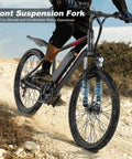 Peak 500W Electric Bike For Adults With Removable Battery 20 MPH City Commuter Cruise Delivers Up To 40 Miles All Terrain Electric Bike With 7 Speed Fork Suspension And Dual Disc Brakes Includes Four Accessories on rocky terrain