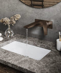 Single-Handle Wall-Mount Bathroom Faucet In Oil Rubbed Bronze, Solid Brass Construction, 1.2 GPM Flow over a marble sink