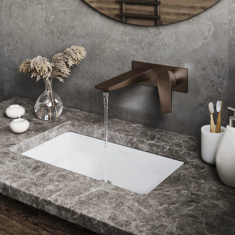 Single-Handle Wall-Mount Bathroom Faucet In Oil Rubbed Bronze, Solid Brass Construction, 1.2 GPM Flow over a marble sink