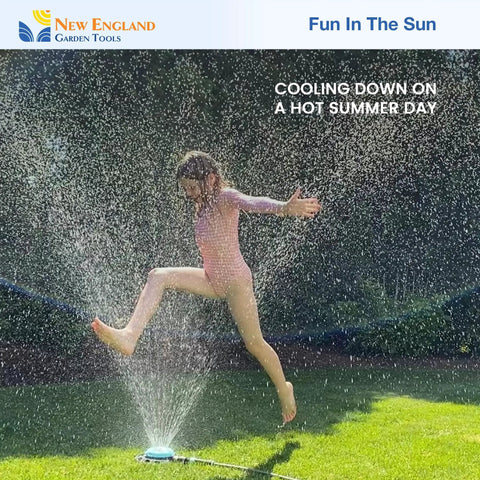 Child playing in water spray from adjustable nine pattern spot sprinkler with heavy duty metal base on a hot summer day.