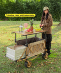Heavy Duty Collapsible Folding Wagon With Integrated Aluminum Table All Terrain Beach Cart With Open Tailgate in use outdoors
