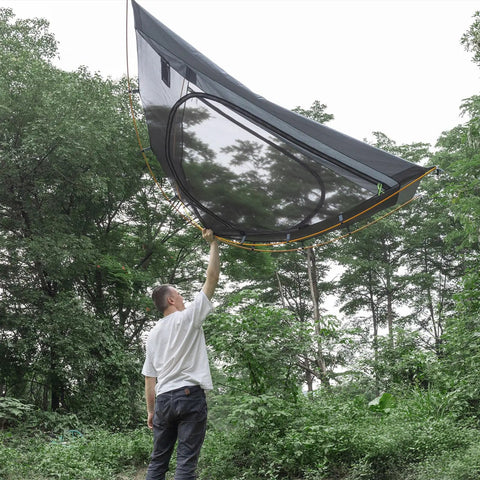 Man holding Ultra Lightweight 2 Person Backpacking Tent With Aluminum Poles Waterproof Rainfly For Hiking And Camping Army Green