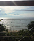 Coastal view through cable railings with Self Locking Swageless Quick Connector for One Eighth Inch Cable Railings.