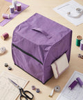 Purple serger dust cover for overlock machine 31x28x31cm universal fit Oxford cloth with handle and pockets on sewing table.