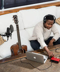 Scarlett Solo 3rd Gen USB Audio Interface Bundle With LyxPro Cardioid Condenser Mic, Shock Mount, and Studio Headphones in use