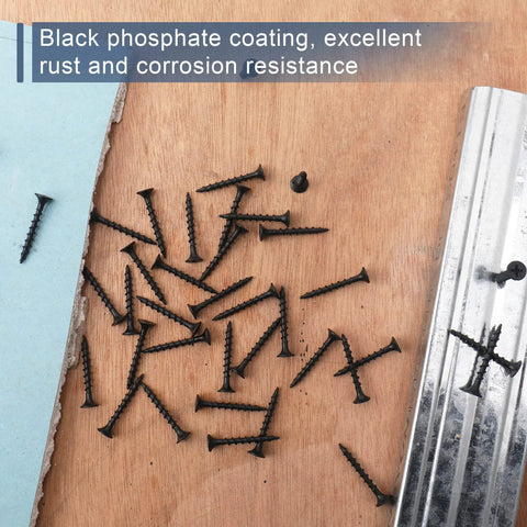 210 Piece Six Gauge One And A Quarter Inch Drywall Screws Black Oxide Coated Carbon Steel scattered on wood surface