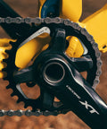 Black 34T Narrow Wide Chainring for 9 to 12 Speed Cranks Asymmetric 96mm BCD Interface on yellow bike frame