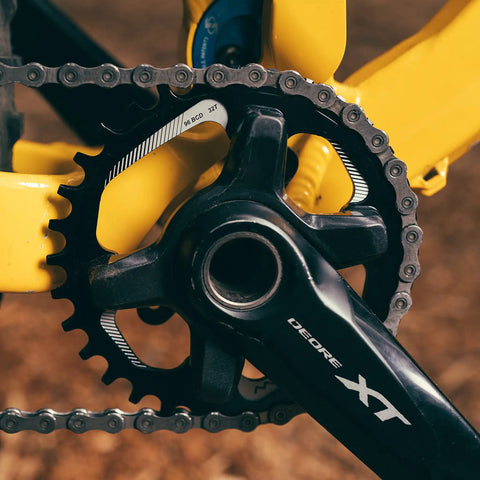 Black 34T Narrow Wide Chainring for 9 to 12 Speed Cranks Asymmetric 96mm BCD Interface on yellow bike frame