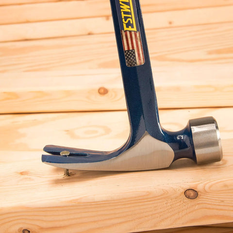 Big Blue Framing Hammer 25 Oz Pro Grade USA Made Built Tough With Straight Rip Claw prying nail from wooden board