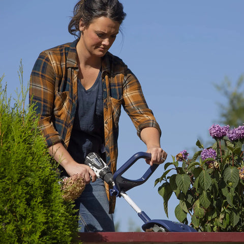 Person using Drill Powered Cultivator Attachment For Cordless Drills, Flexible Width Up To 8 Inches, Lightweight Durable Model 46007 in garden