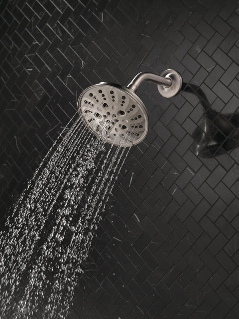 H2Okinetic Rain Shower Head With Five Settings In Stainless Finish Touch Clean Nozzle System spraying water in bathroom