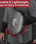 Man wearing Battle Ready Medieval Buckler Shield With 16 Gauge Steel Construction And Arrow Edge Details, costume accessory focus