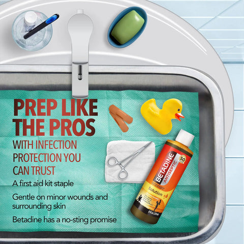 Antiseptic First Aid Solution With Povidone Iodine 10 Percent For Infection Protection Kills Germs In Minor Cuts Scrapes And Burns No Sting Formula No Alcohol Or Hydrogen Peroxide 8 Fl Oz Trusted By Healthcare Professionals bottle next to rubber duck and sink.