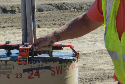 Worker using 24 Inch Reusable Pole Base Template For Quick Setup, Multi Size 18 24 30 And Square Foundation Edition in construction
