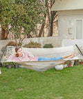 Two Person Rope Hammock With Hardwood Spreader Bar For Indoor Outdoor Use, Handwoven Caribbean Style, cream color in backyard