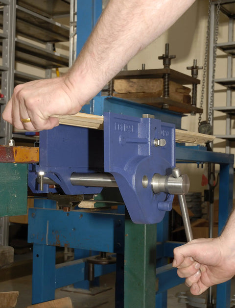 Beefy 7 Inch Quick Release Woodworking Vise With Heavy Duty Cast Iron Body in use on bench, showing clamping mechanism