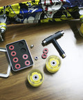 Ceramic Skateboard Bearings High Speed 608 RS Double Shielded ABEC-11 8 Pack Set with wheels and skateboard on wood table