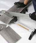 Person using Fully Assembled Laminate And Vinyl Floor Cutter For Small Jobs, Cuts 2-5mm Thick Rubber, Laminate, VCT, PVC And Steel Or Aluminum
