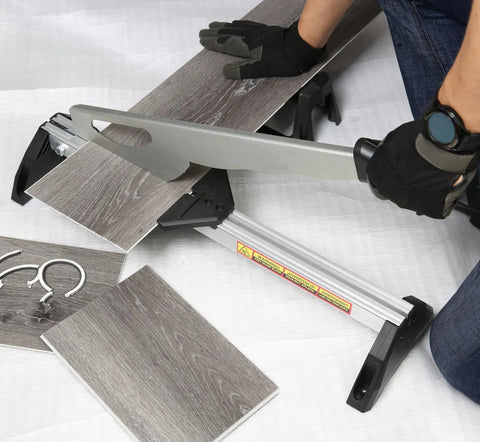 Person using Fully Assembled Laminate And Vinyl Floor Cutter For Small Jobs, Cuts 2-5mm Thick Rubber, Laminate, VCT, PVC And Steel Or Aluminum