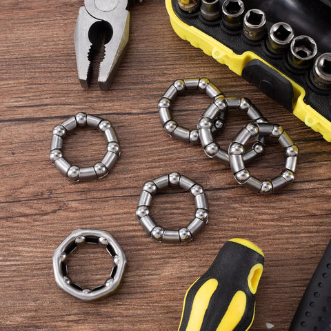 Six Pack Bicycle Crank Bearing Set 5/16 Inch 7 Balls 38 OD 24 ID 8 MM Ball Size Replacement Bottom Bracket Bearings on wooden surface
