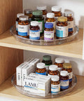 Smooth Operator 12 in Lazy Susan Turntable 4 Pack Crystal Clear BPA Free Plastic Pantry Cabinet Organizer for Spice Rack 360 Spin holds bottles and boxes on a shelf.