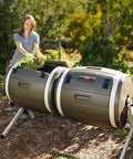 Double Bin Rotating Composter With Two 50 Gallon Barrels For Nonstop Composting in outdoor garden setting