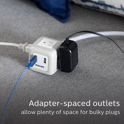 Flat Plug Cube Extension Cord with 10 ft reach, 3 grounded outlets and 2 USB ports, gray white, space saving, on carpet