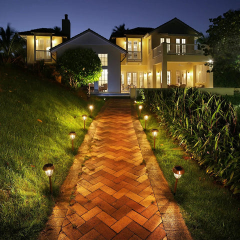 Six Pack Solar Pathway Lights Outdoor 25 Lumens Warm White 3000K IP65 Weatherproof Metal And Glass Landscape Lights illuminating a walkway
